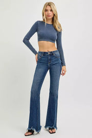Fabric detail of the DARK RISEN Full Size Mid Rise Flare Frayed Hem Jeans Plus Size, styled with polished boutique styling for day-to-night outfits, made for women who want easy layering.