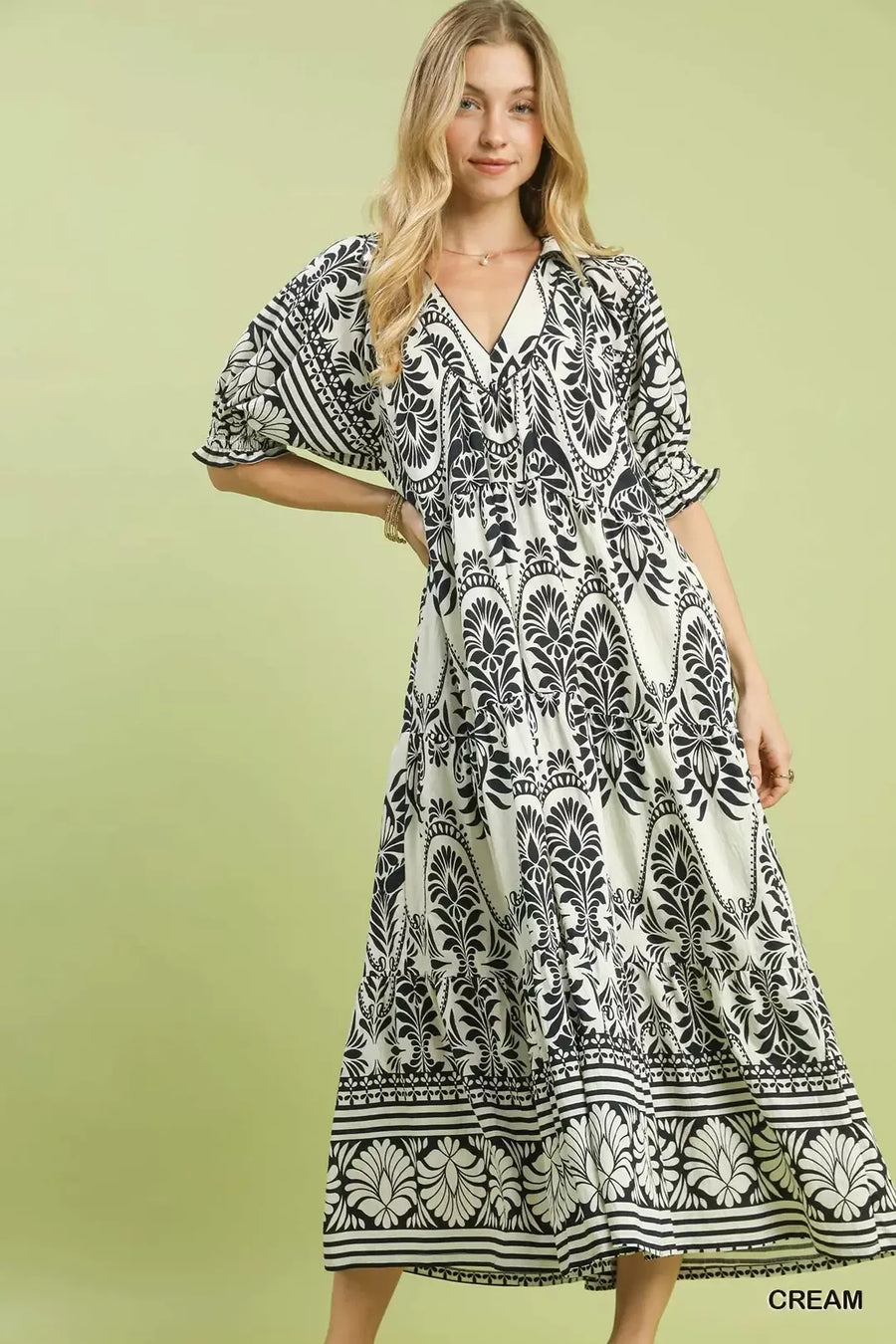 Front view of the CREAM Two tone Border Print Midi Dress, styled with feminine boutique styling for dinners, travel, and events, made for women who want elegant styling.