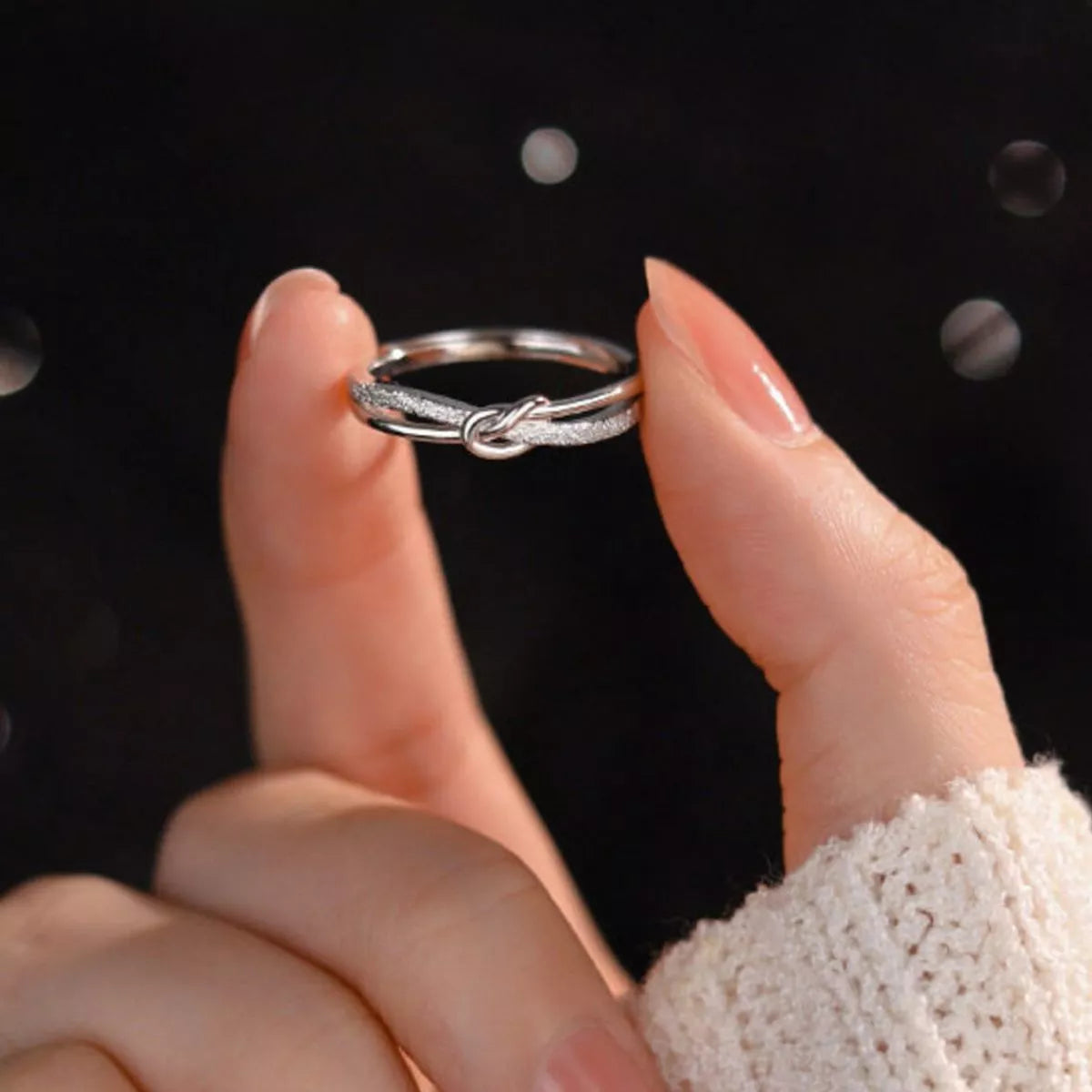 Side view of the Women's Silver Minimalist 925 Sterling Knot Ring for Everyday Styling & Gifting, styled with delicate sparkle for daily wear and gifting, made for women who want refined jewelry.