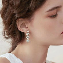 Bundle outfit view of the Women's Silver Minimalist 925 Sterling Moissanite Leaf Earrings for Everyday Styling & Gifting, styled with light-catching shine for workdays, dinners, and gifting, made for women who want lightweight shine.