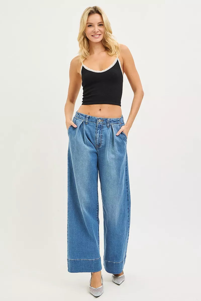 Fabric detail of the MEDIUM RISEN Slouchy Wide Leg Jeans With Pleats, styled with polished boutique styling for day-to-night outfits, made for women who want easy layering.