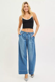Fabric detail of the MEDIUM RISEN Slouchy Wide Leg Jeans With Pleats, styled with polished boutique styling for day-to-night outfits, made for women who want easy layering.