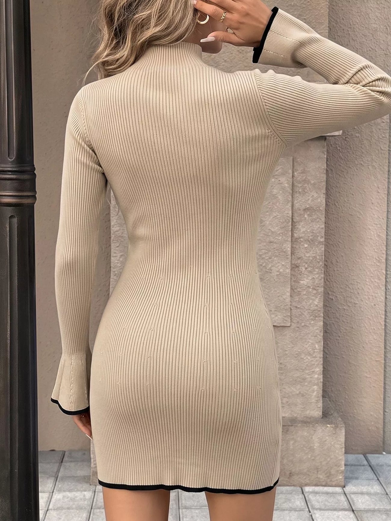 Full-length view of the Khaki Ribbed Mock Neck Flare Sleeve Sweater Dress, styled with feminine boutique styling for dinners, travel, and events, made for women who want elegant styling.