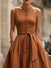 Front view of the Black Full Size Sleeveless Button-Front Belted Midi Dress Plus Size, styled with feminine boutique styling for dinners, travel, and events, made for women who want elegant styling.