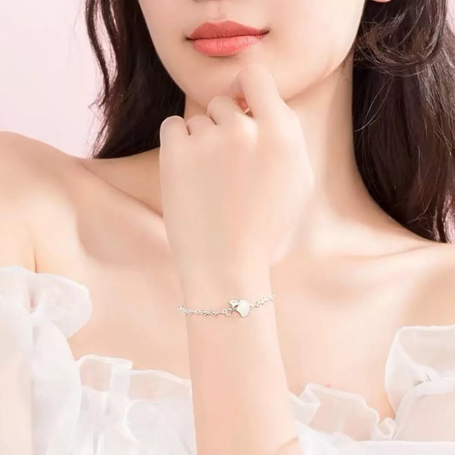 Front view of the 925 Sterling Silver Ginkgo Leaf Bracelet, styled with soft-shine jewelry for daily outfits and gifting, made for women who want stackable jewelry.