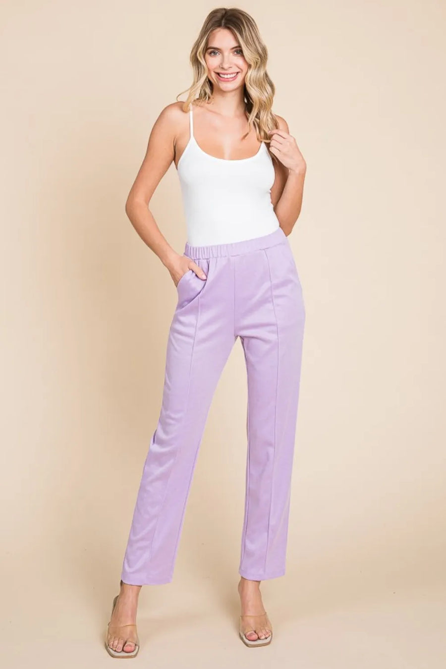 Front view of the Lilac Pin Tuck Slim Pants, styled with polished comfort for work, travel, and everyday wear, made for women who want repeat outfit options.