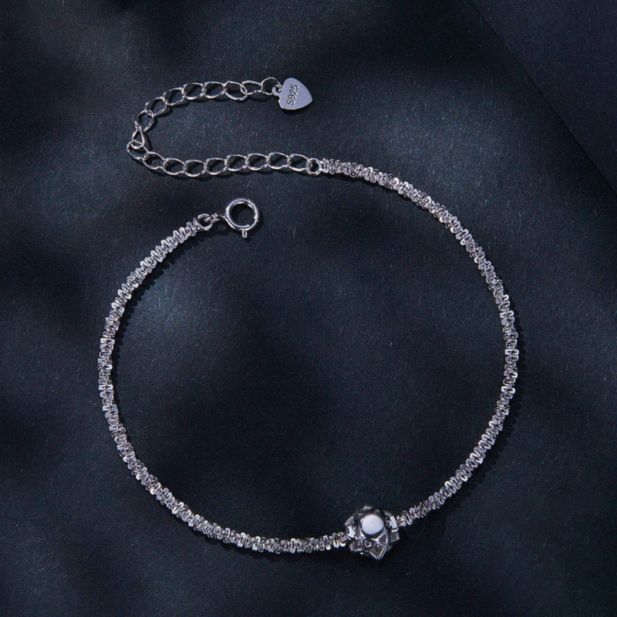 Side view of the 925 Sterling Silver Zircon Bracelet, styled with soft-shine jewelry for daily outfits and gifting, made for women who want stackable jewelry.