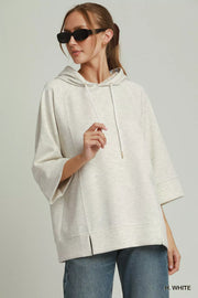 Front view of the H. WHITE Umgee 3/4 Sleeve Tunic Top with Graphic Hoodie, styled with polished boutique styling for day-to-night outfits, made for women who want easy layering.