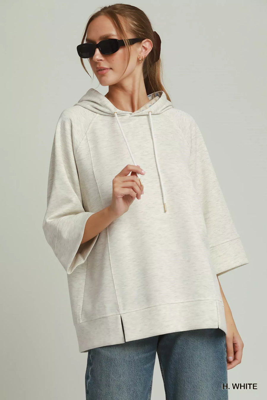 Front view of the H. WHITE Umgee 3/4 Sleeve Tunic Top with Graphic Hoodie, styled with polished boutique styling for day-to-night outfits, made for women who want easy layering.