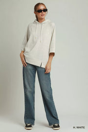 Neckline detail of the H. WHITE Umgee 3/4 Sleeve Tunic Top with Graphic Hoodie, styled with polished boutique styling for day-to-night outfits, made for women who want easy layering.