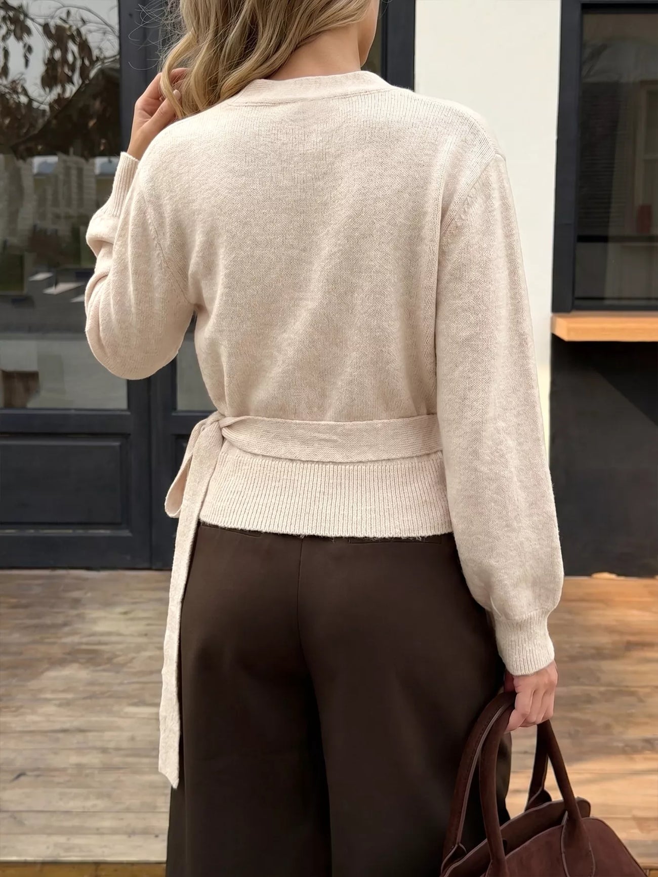 Styled outfit view of the Apricot Tied Surplice Long Sleeve Sweater, styled with polished boutique styling for day-to-night outfits, made for women who want easy layering.