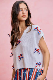 Fabric detail of the OFF WHITE SO ME 4th Of July Ribbon Trimmed Dolman Sweater Top, styled with polished boutique styling for day-to-night outfits, made for women who want easy layering.