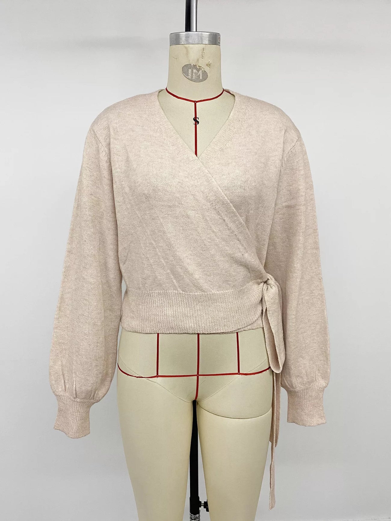 Styled outfit view of the Apricot Tied Surplice Long Sleeve Sweater, styled with polished boutique styling for day-to-night outfits, made for women who want easy layering.