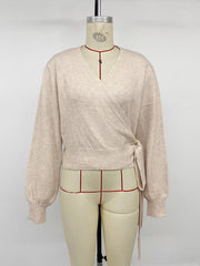 Styled outfit view of the Apricot Tied Surplice Long Sleeve Sweater, styled with polished boutique styling for day-to-night outfits, made for women who want easy layering.