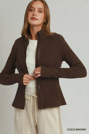 Neckline detail of the COCO BROWN Umgee Soft Fleece Full Zip Jacket With Pockets, styled with polished boutique styling for day-to-night outfits, made for women who want easy layering.