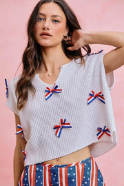Styled outfit view of the OFF WHITE SO ME 4th Of July Ribbon Trimmed Dolman Sweater Top, styled with polished boutique styling for day-to-night outfits, made for women who want easy layering.