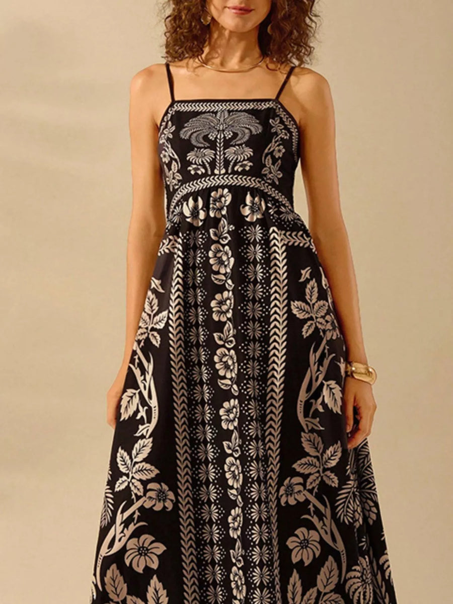 Front view of the Black Floral Print Spaghetti Strap Maxi Dress, styled with feminine boutique styling for dinners, travel, and events, made for women who want elegant styling.