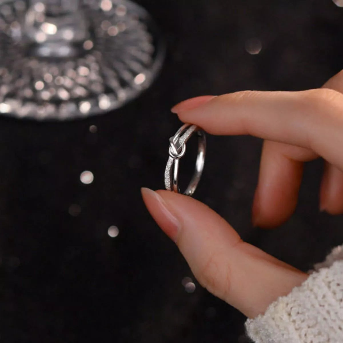 Close-up detail of the Women's Silver Minimalist 925 Sterling Knot Ring for Everyday Styling & Gifting, styled with delicate sparkle for daily wear and gifting, made for women who want refined jewelry.