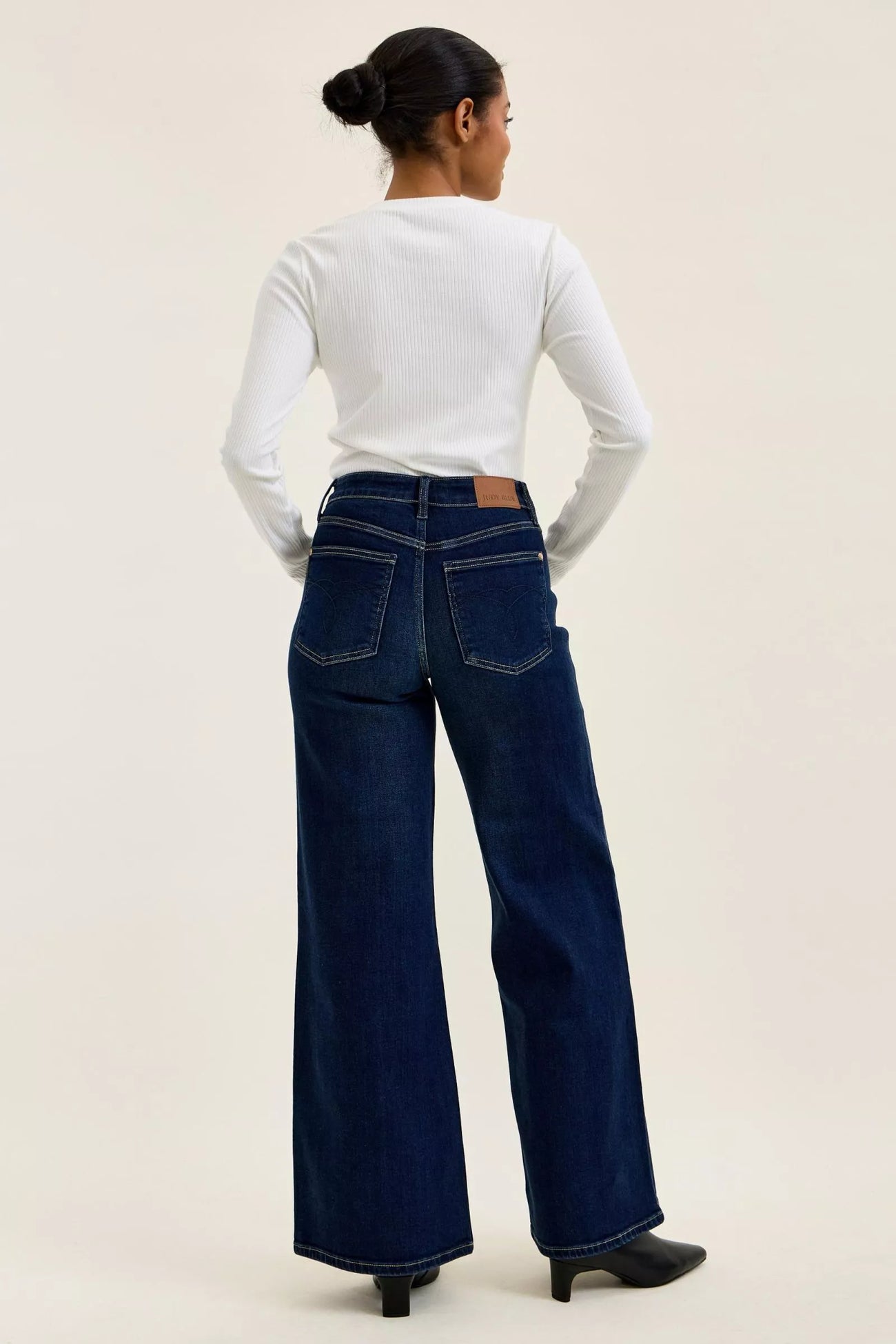 Side view of the DK Judy Blue High-Waisted Wide-Leg Dark Wash Jeans, styled with polished boutique styling for day-to-night outfits, made for women who want easy layering.