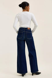 Side view of the DK Judy Blue High-Waisted Wide-Leg Dark Wash Jeans, styled with polished boutique styling for day-to-night outfits, made for women who want easy layering.
