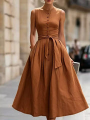 Full-length view of the Caramel Color Full Size Sleeveless Button-Front Belted Midi Dress Plus Size, styled with feminine boutique styling for dinners, travel, and events, made for women who want elegant styling.