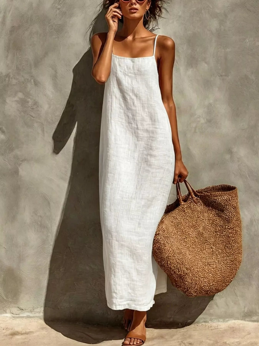 Front view of the White Sleeveless Linen Maxi Dress, styled with feminine boutique styling for dinners, travel, and events, made for women who want elegant styling.