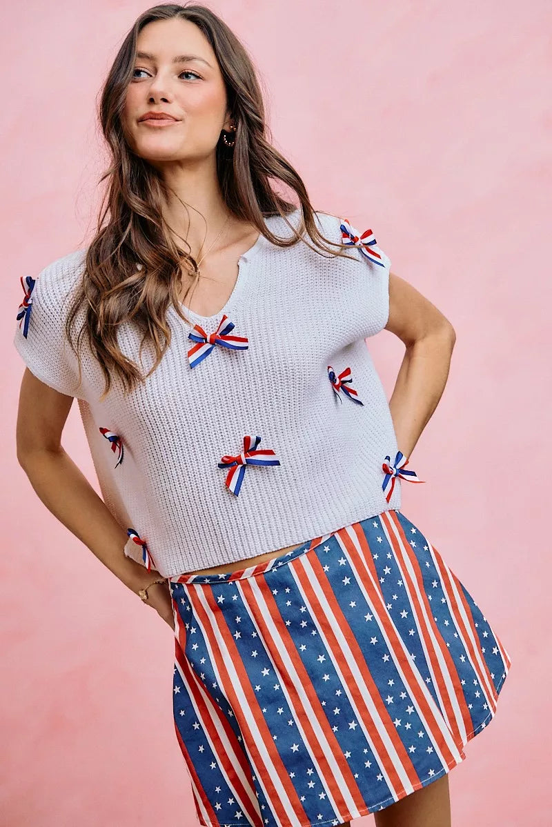 Neckline detail of the OFF WHITE SO ME 4th Of July Ribbon Trimmed Dolman Sweater Top, styled with polished boutique styling for day-to-night outfits, made for women who want easy layering.