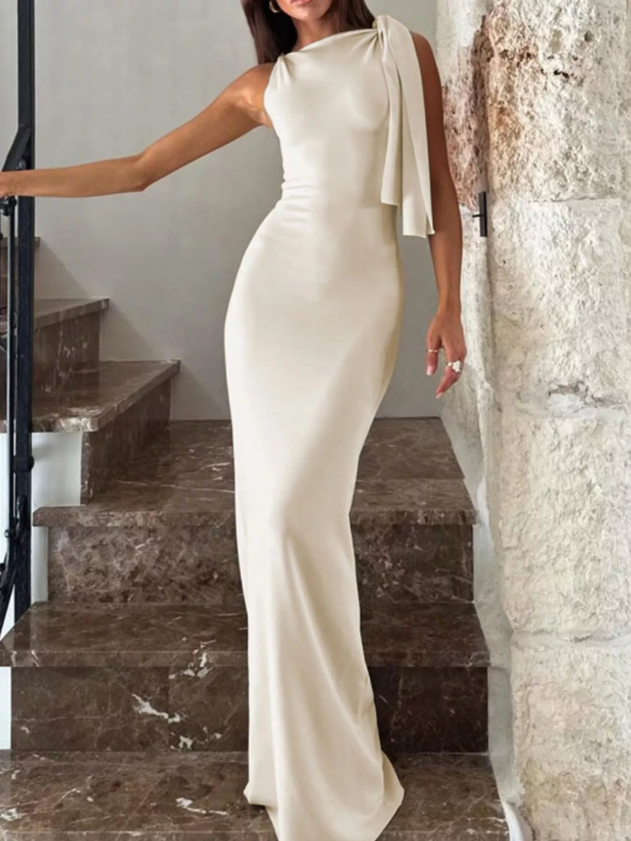 Front view of the Apricot Sleeveless Maxi Dress, styled with feminine boutique styling for dinners, travel, and events, made for women who want elegant styling.