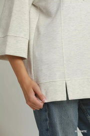 Styled outfit view of the H. WHITE Umgee 3/4 Sleeve Tunic Top with Graphic Hoodie, styled with polished boutique styling for day-to-night outfits, made for women who want easy layering.