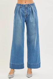 Side view of the MEDIUM RISEN Slouchy Wide Leg Jeans With Pleats, styled with polished boutique styling for day-to-night outfits, made for women who want easy layering.