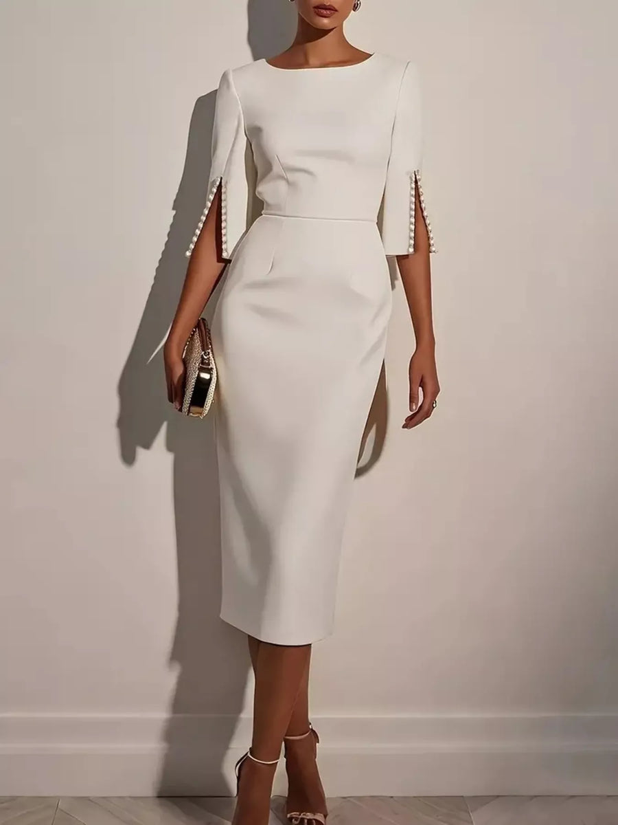 Front view of the White Midi Dress with Beaded Slit Sleeve, styled with feminine boutique styling for dinners, travel, and events, made for women who want elegant styling.