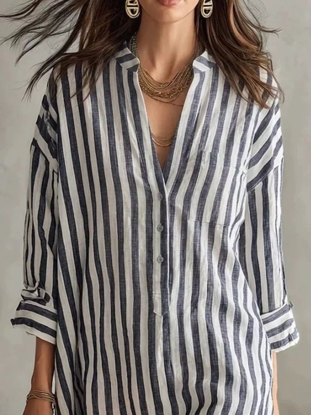Fabric detail of the Black Full Size Striped 3/4 Sleeve Shirt Dress Plus Size, styled with feminine boutique styling for dinners, travel, and events, made for women who want elegant styling.