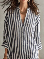 Fabric detail of the Black Full Size Striped 3/4 Sleeve Shirt Dress Plus Size, styled with feminine boutique styling for dinners, travel, and events, made for women who want elegant styling.