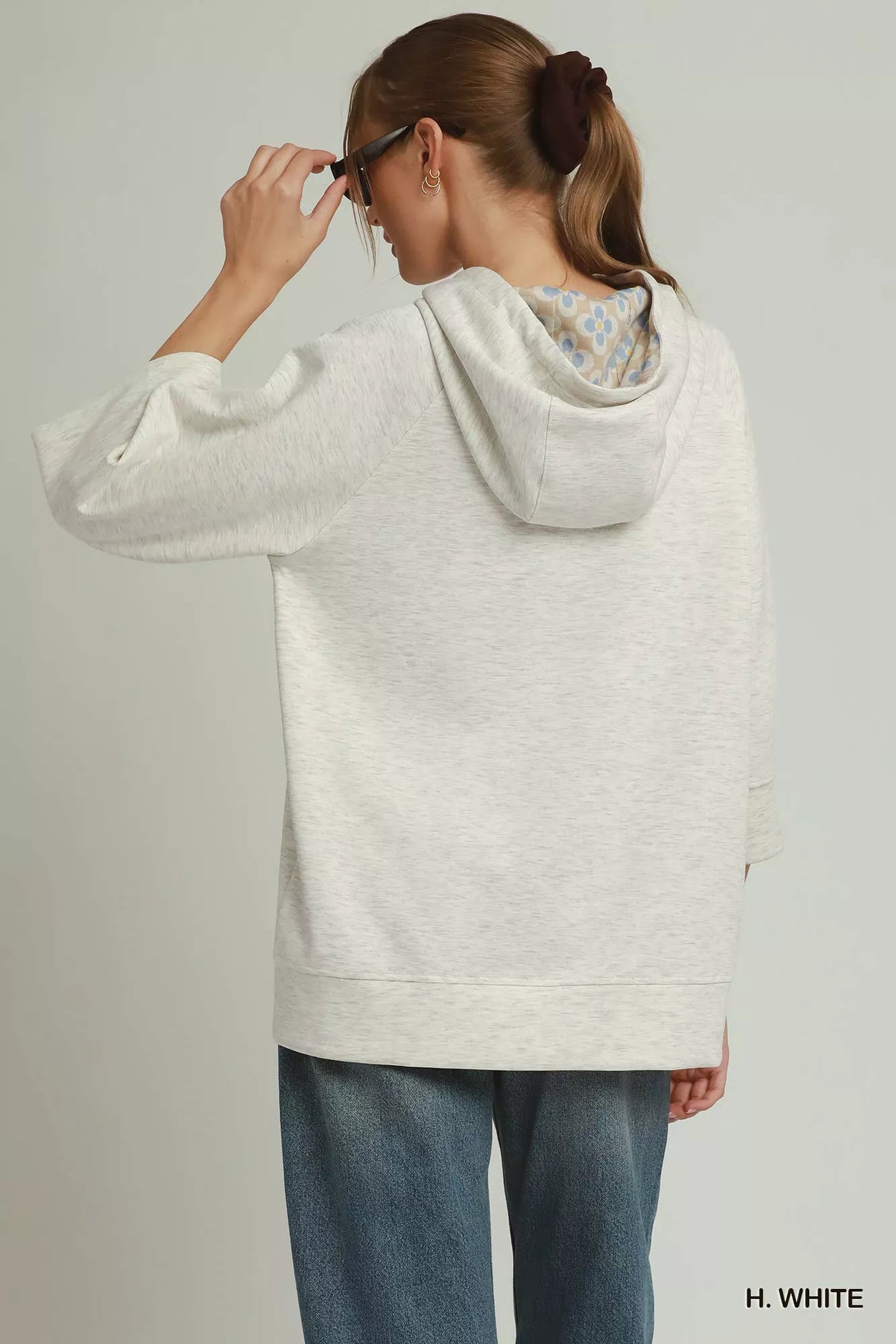 Back view of the H. WHITE Umgee 3/4 Sleeve Tunic Top with Graphic Hoodie, styled with polished boutique styling for day-to-night outfits, made for women who want easy layering.