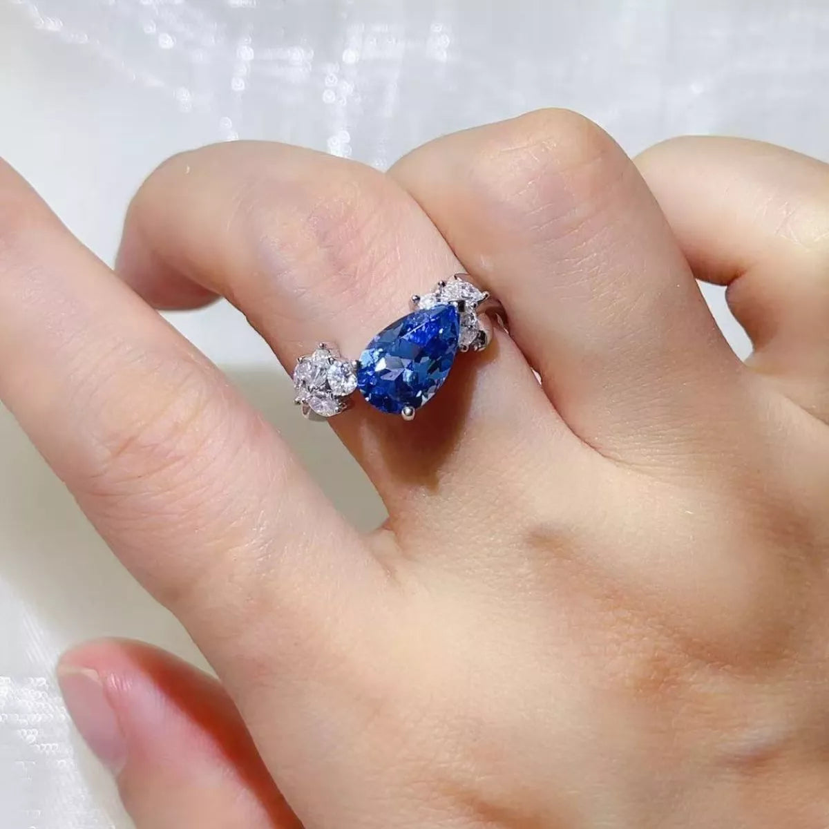 Close-up detail of the Royal Blue 3 Carat Moissanite 925 Sterling Silver Ring, styled with delicate sparkle for daily wear and gifting, made for women who want refined jewelry.