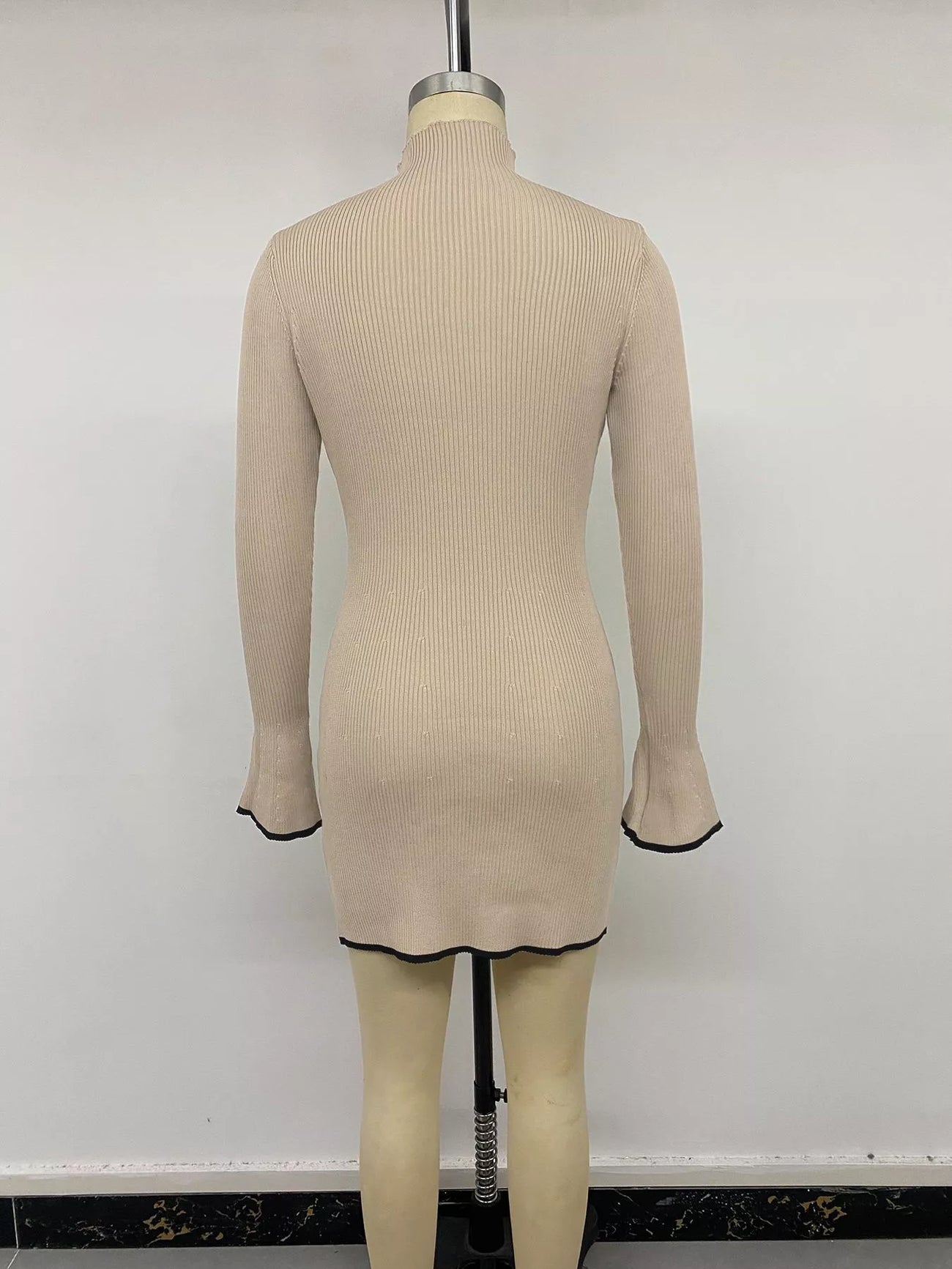 Front view of the Khaki Ribbed Mock Neck Flare Sleeve Sweater Dress, styled with feminine boutique styling for dinners, travel, and events, made for women who want elegant styling.