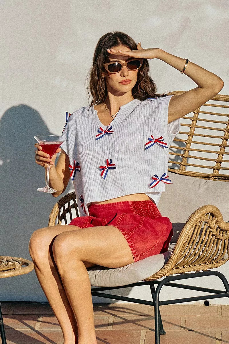 Side view of the OFF WHITE SO ME 4th Of July Ribbon Trimmed Dolman Sweater Top, styled with polished boutique styling for day-to-night outfits, made for women who want easy layering.