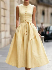 Styled outfit view of the Yellow Full Size Sleeveless Button-Front Belted Midi Dress Plus Size, styled with feminine boutique styling for dinners, travel, and events, made for women who want elegant styling.
