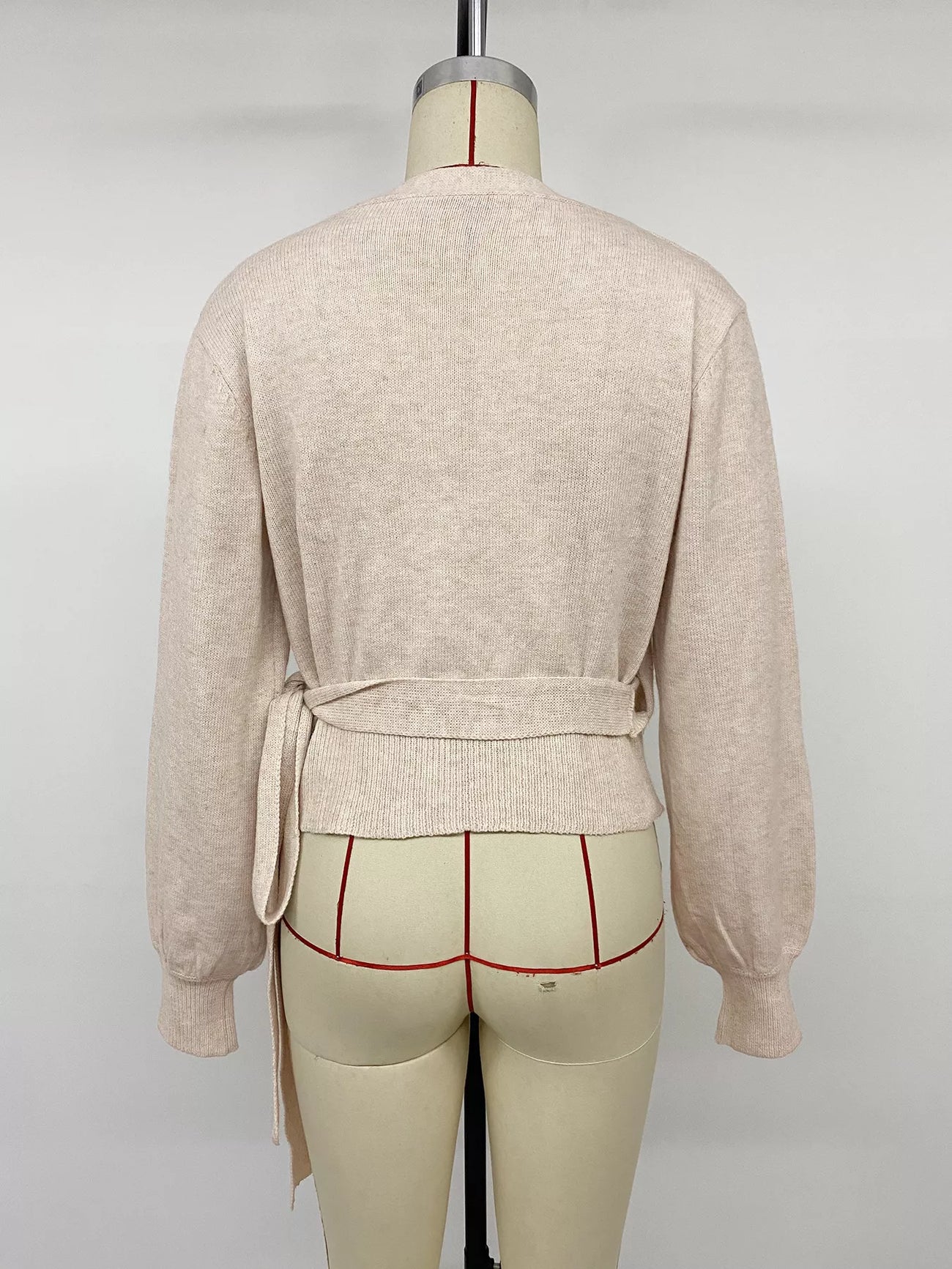 Front view of the Apricot Tied Surplice Long Sleeve Sweater, styled with polished boutique styling for day-to-night outfits, made for women who want easy layering.