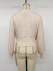 Front view of the Apricot Tied Surplice Long Sleeve Sweater, styled with polished boutique styling for day-to-night outfits, made for women who want easy layering.