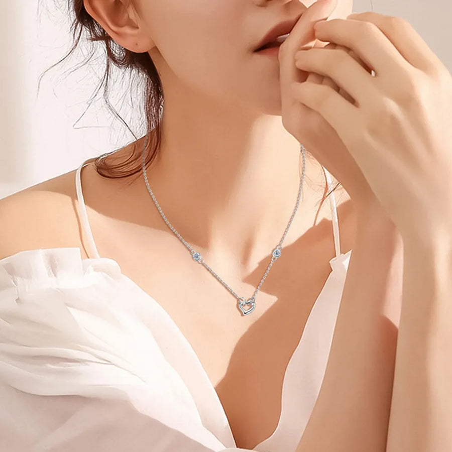 Front view of the Silver Heart Moissanite Necklace, styled with layered jewelry for everyday styling and gifting, made for women who want refined neckline detail.