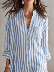 Side view of the Blue Full Size Striped 3/4 Sleeve Shirt Dress Plus Size, styled with feminine boutique styling for dinners, travel, and events, made for women who want elegant styling.