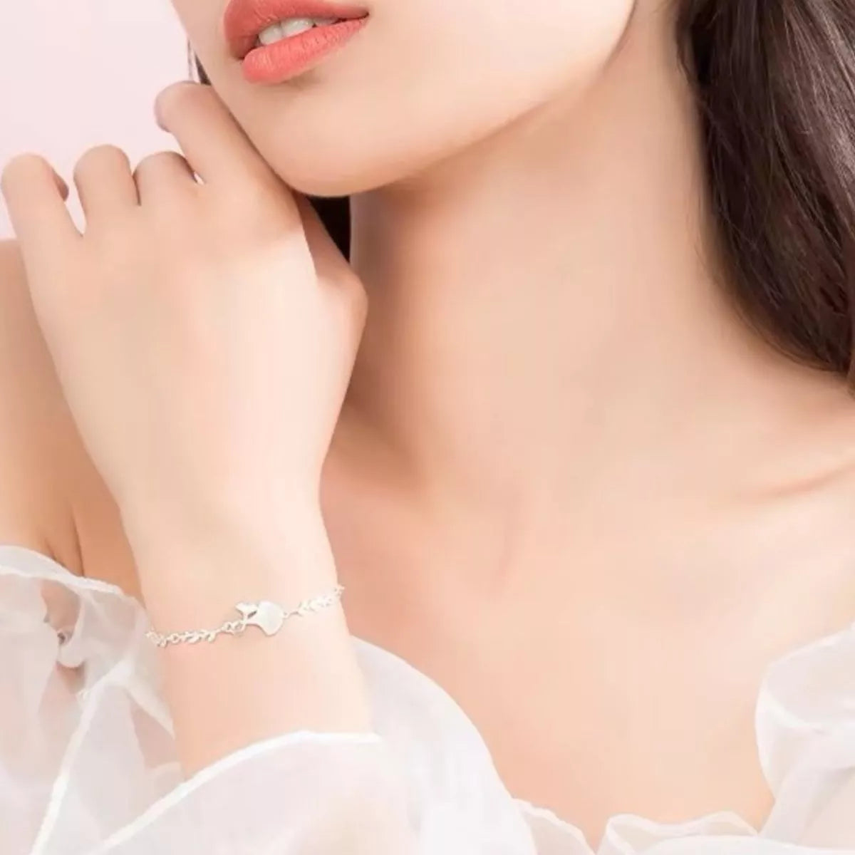 Side view of the 925 Sterling Silver Ginkgo Leaf Bracelet, styled with soft-shine jewelry for daily outfits and gifting, made for women who want stackable jewelry.
