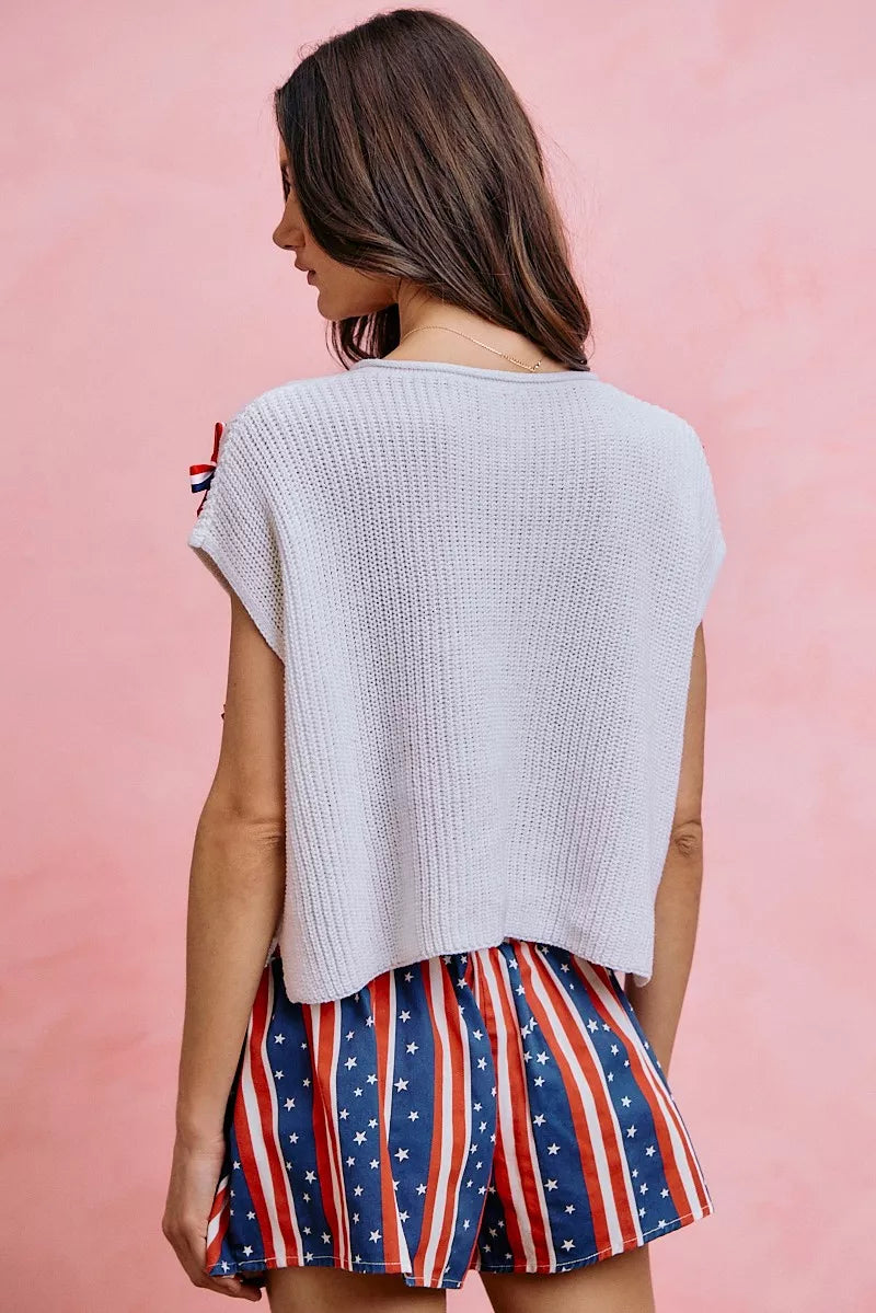 Side view of the OFF WHITE SO ME 4th Of July Ribbon Trimmed Dolman Sweater Top, styled with polished boutique styling for day-to-night outfits, made for women who want easy layering.