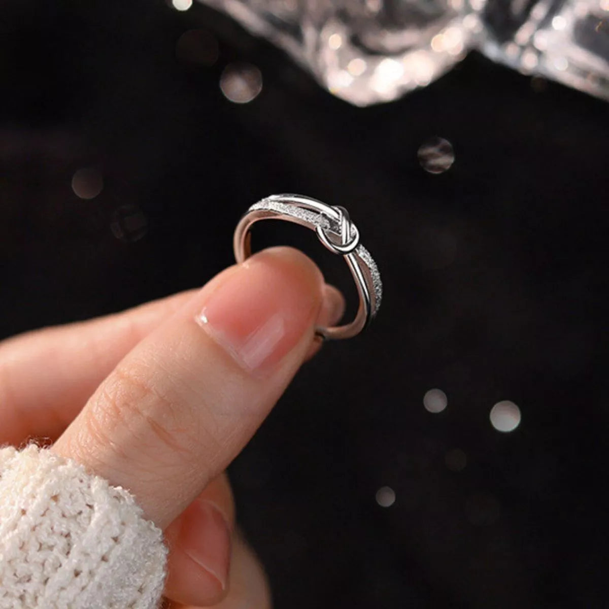 Side view of the Women's Silver Minimalist 925 Sterling Knot Ring for Everyday Styling & Gifting, styled with delicate sparkle for daily wear and gifting, made for women who want refined jewelry.