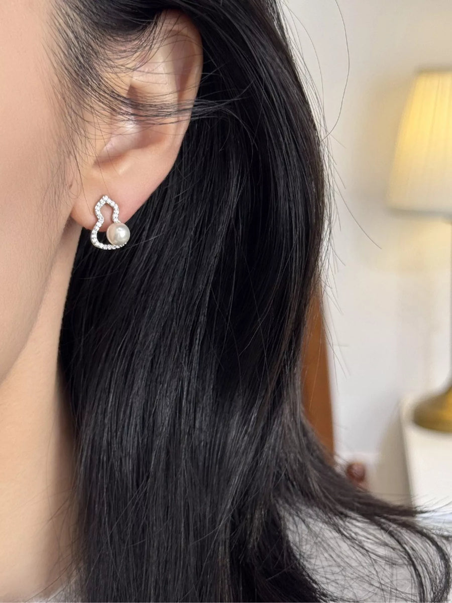 Front view of the Silver Gourd Pearl Earrings, styled with light-catching shine for workdays, dinners, and gifting, made for women who want lightweight shine.