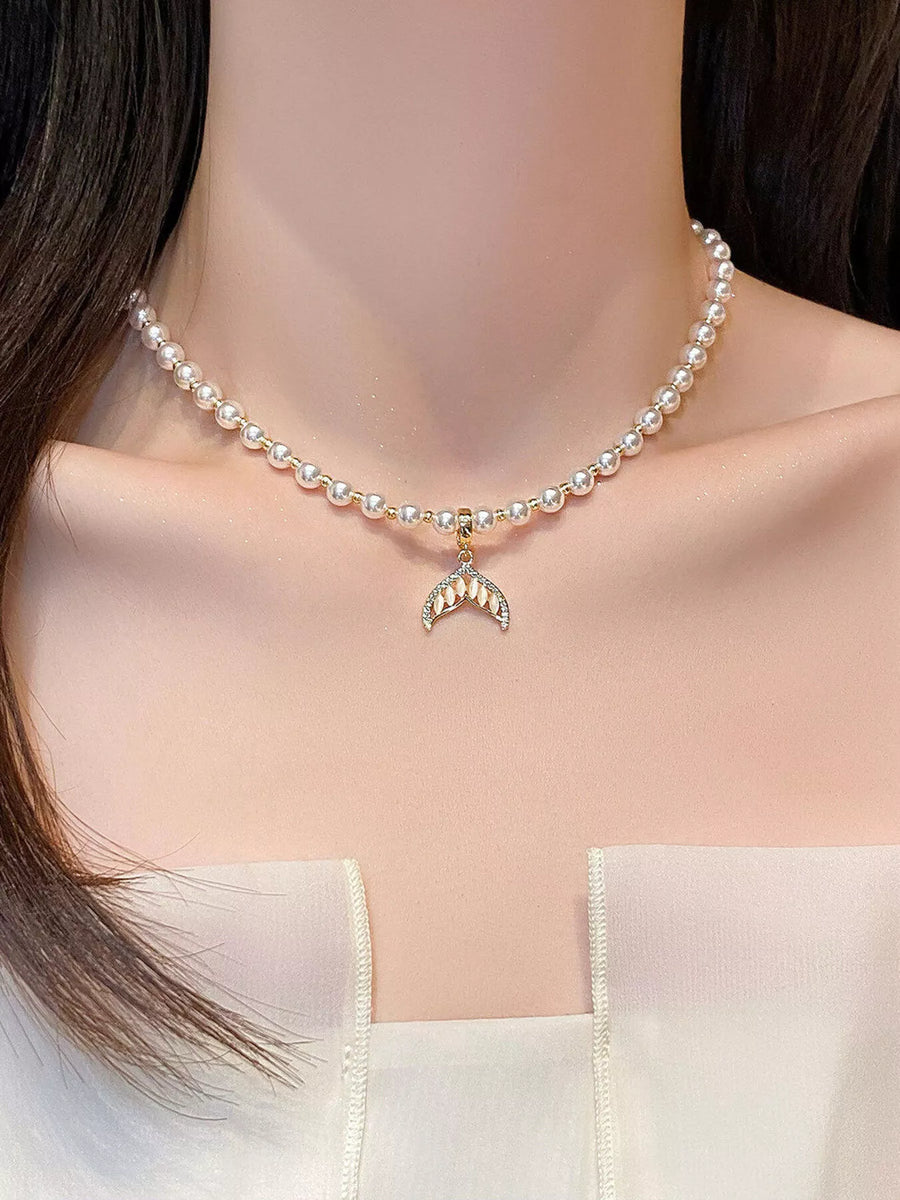 Front view of the Silver Mermaid Tail Pearl Necklace, styled with layered jewelry for everyday styling and gifting, made for women who want refined neckline detail.