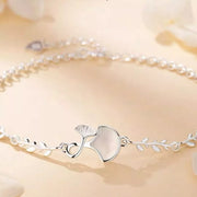 Stacked styling view of the 925 Sterling Silver Ginkgo Leaf Bracelet, styled with soft-shine jewelry for daily outfits and gifting, made for women who want stackable jewelry.