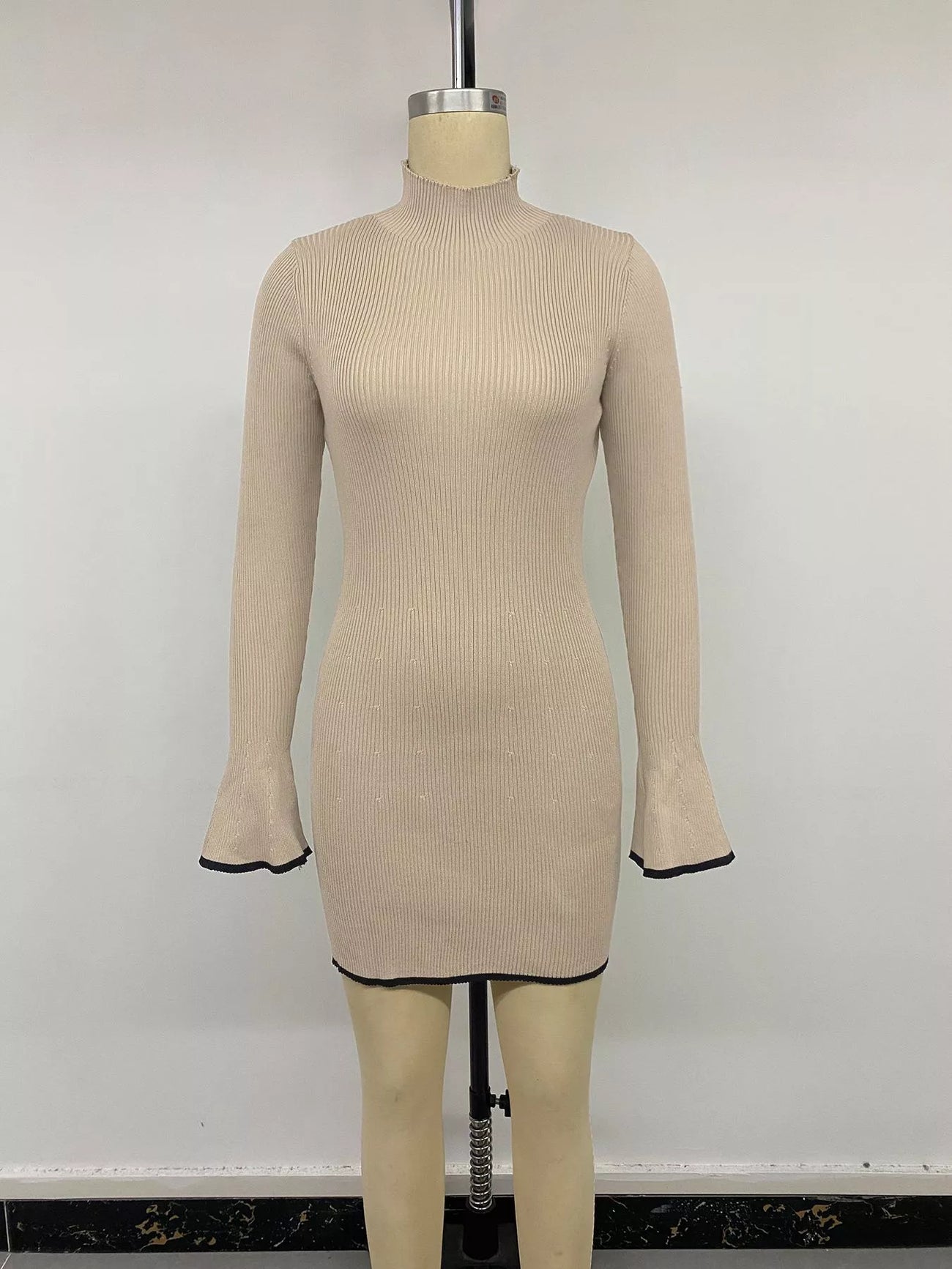 Styled outfit view of the Khaki Ribbed Mock Neck Flare Sleeve Sweater Dress, styled with feminine boutique styling for dinners, travel, and events, made for women who want elegant styling.