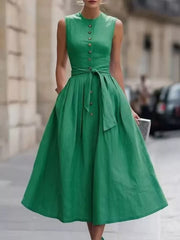 Fabric detail of the Dark Green Full Size Sleeveless Button-Front Belted Midi Dress Plus Size, styled with feminine boutique styling for dinners, travel, and events, made for women who want elegant styling.